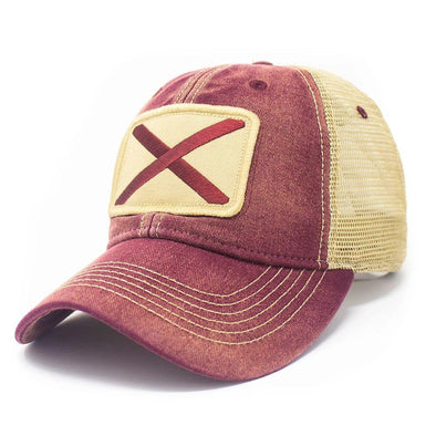 Brick colored trucker hat with khaki mesh panels on the back and tan stitching. Ballcap is embroidered with the Alabama flag. The patch depicts a red X inside of a natural pigmented rectangle.