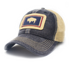 Black colored trucker hat with khaki mesh panels on the back and tan stitching. Ballcap is embroidered with the Wyoming flag. The patch depicts a natural Bison inside of a dark blue rectangle with a red border.